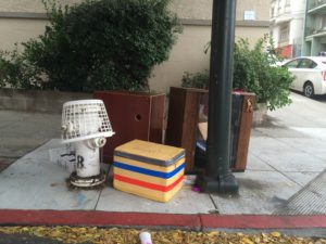 Basket and boxes next to a fire hydrant in San Francisco.